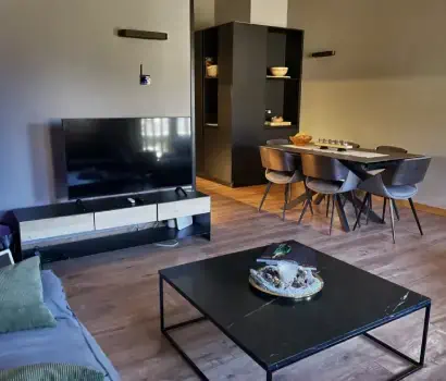Vacation Rental Apartment, El Tarter by Kokono - livng room with dining table and sitting area